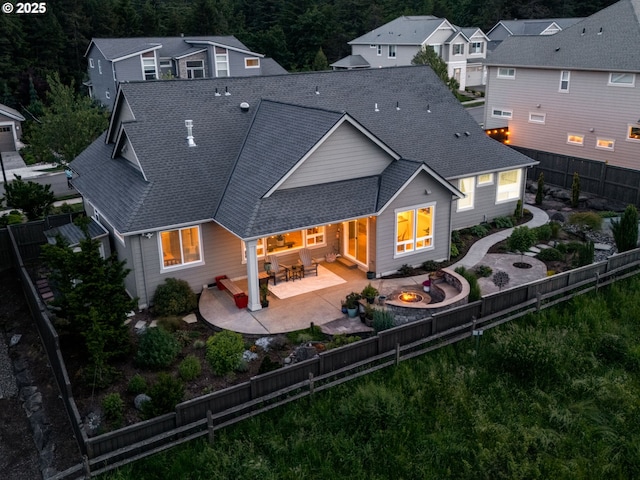 1856 NW Sierra Way, Camas, WA 98607 - back of house featuring a fire pit, a shingled roof, a patio area, and a fenced backyard