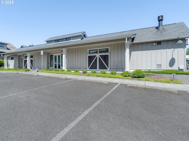 1856 NW Sierra Way, Camas, WA 98607 - view of front of property with board and batten siding, uncovered parking, a shingled roof, and covered porch