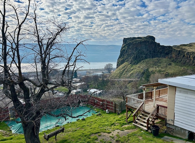 exterior space featuring a swimming pool side deck with mountain view