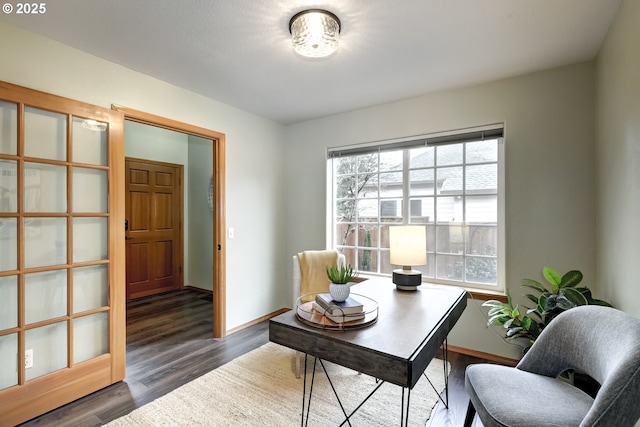 home office with dark hardwood / wood-style floors