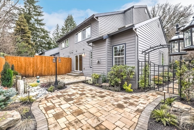 back of house with a patio