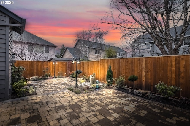 view of patio terrace at dusk