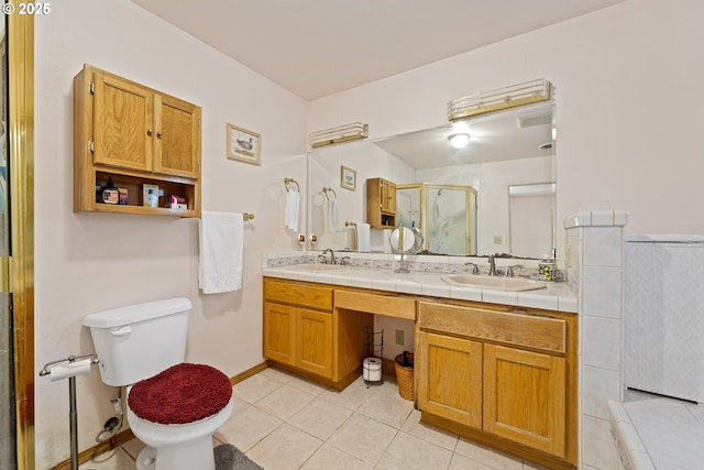 905 Summit Loop, Grants Pass, OR 97527 - full bath featuring a shower stall, double vanity, tile patterned floors, and toilet