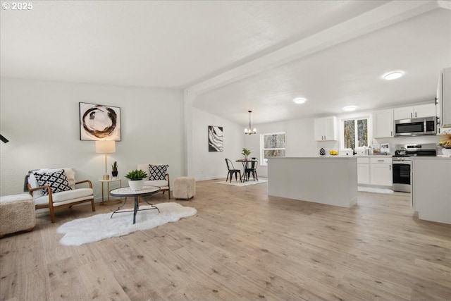 662 Cannavina Rd, Carson, WA 98610 - living area featuring a chandelier and light wood-style flooring