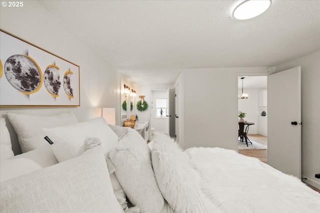 662 Cannavina Rd, Carson, WA 98610 - bedroom featuring a chandelier and a textured ceiling