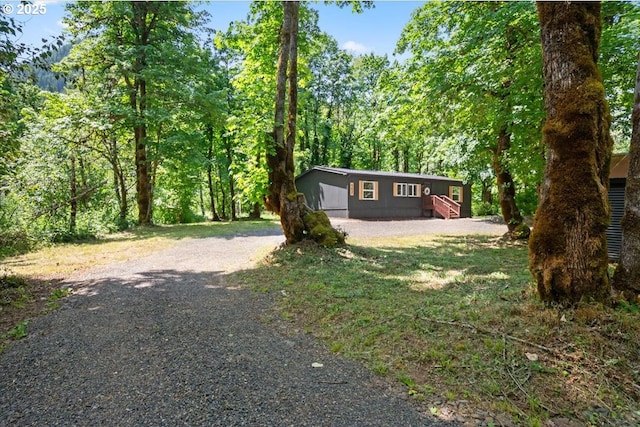 662 Cannavina Rd, Carson, WA 98610 - view of front of home featuring gravel driveway and a wooded view