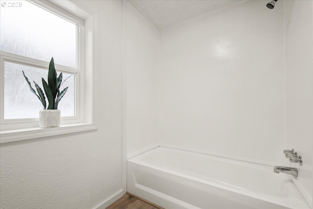 662 Cannavina Rd, Carson, WA 98610 - full bath with  shower combination, wood finished floors, and a textured ceiling