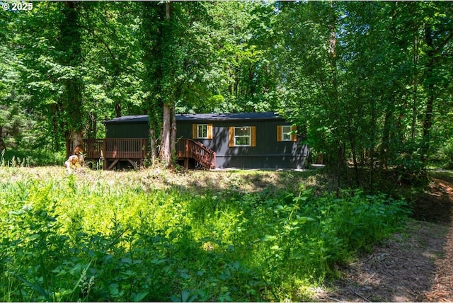 662 Cannavina Rd, Carson, WA 98610 - view of front of house featuring a deck and a view of trees