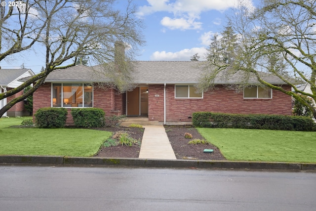 ranch-style house with a front yard