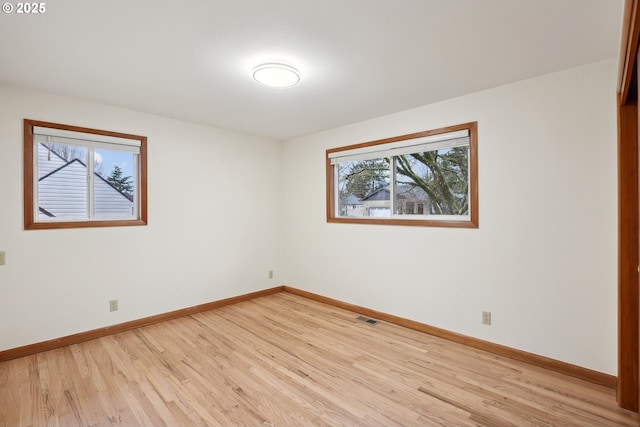 empty room with light wood-type flooring