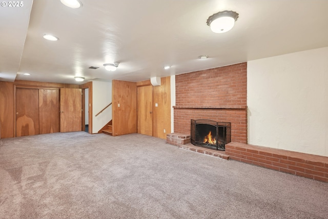 interior space featuring carpet and a fireplace