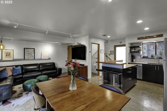 dining room with recessed lighting