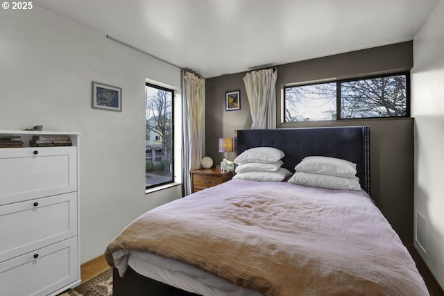 bedroom featuring wood finished floors