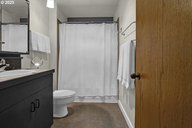 bathroom with vanity, baseboards, toilet, and curtained shower