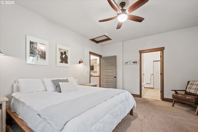 bedroom with light colored carpet, attic access, a ceiling fan, connected bathroom, and baseboards