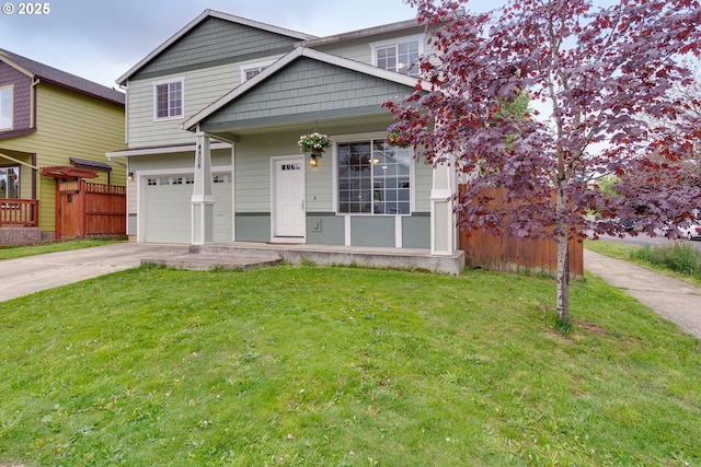 view of front of house with a front lawn, concrete driveway, fence, and an attached garage