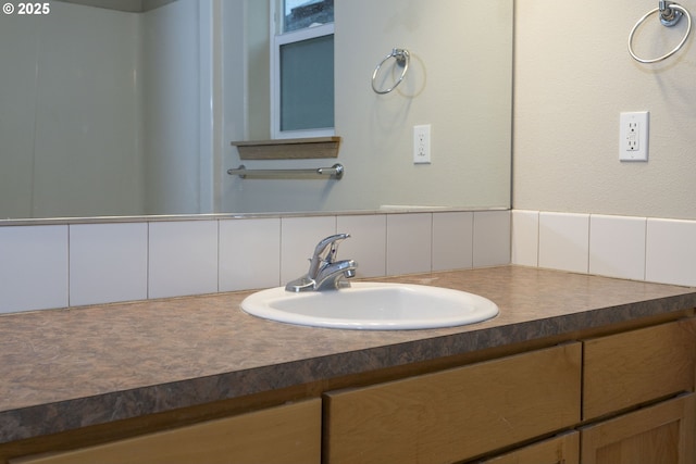 bathroom with backsplash and vanity