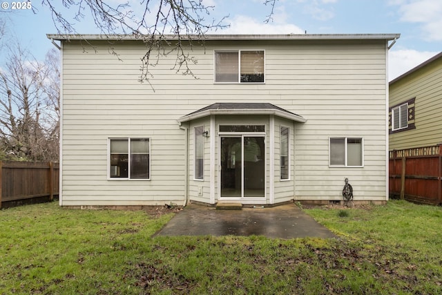 back of house with a patio area, a fenced backyard, and a lawn