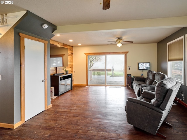 living room with ceiling fan, baseboards, dark wood-type flooring, and recessed lighting