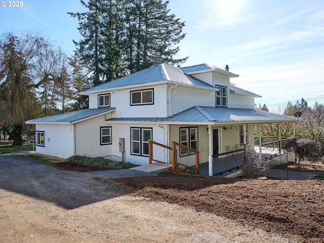 view of front facade with a porch and metal roof