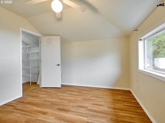 23860 S Beavercreek Rd, Beavercreek, OR 97004 - unfurnished bedroom featuring vaulted ceiling, light wood-style floors, a closet, a spacious closet, and a ceiling fan