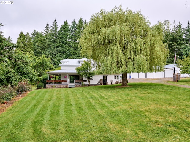 23860 S Beavercreek Rd, Beavercreek, OR 97004 - view of grassy yard featuring a porch, a garage, and an outbuilding
