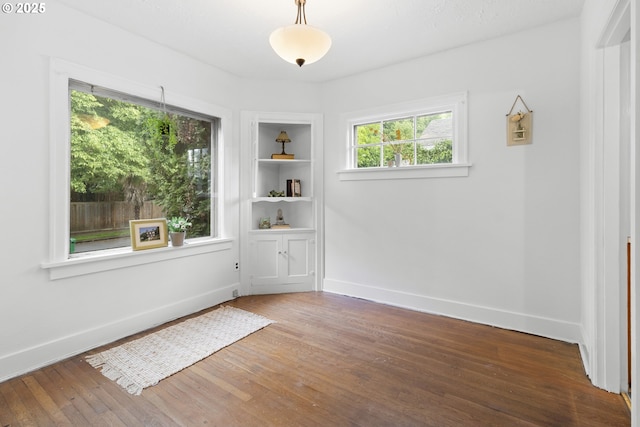 1937 SE Knight St, Portland, OR 97202 - unfurnished dining area with wood finished floors and baseboards
