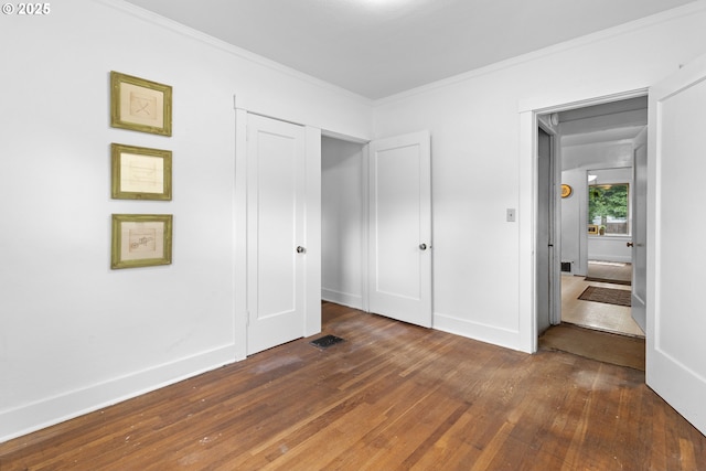 1937 SE Knight St, Portland, OR 97202 - unfurnished bedroom with wood finished floors, ornamental molding, and baseboards