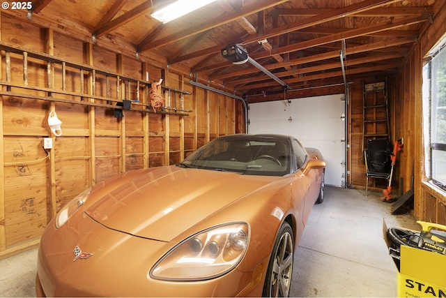 1937 SE Knight St, Portland, OR 97202 - garage featuring wooden walls and a garage door opener