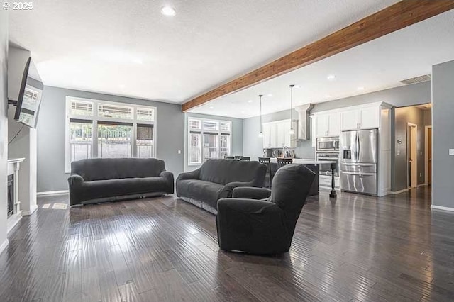 11364 James Way Dr SE, Aumsville, OR 97325 - living area with baseboards, beamed ceiling, recessed lighting, and dark wood-style flooring