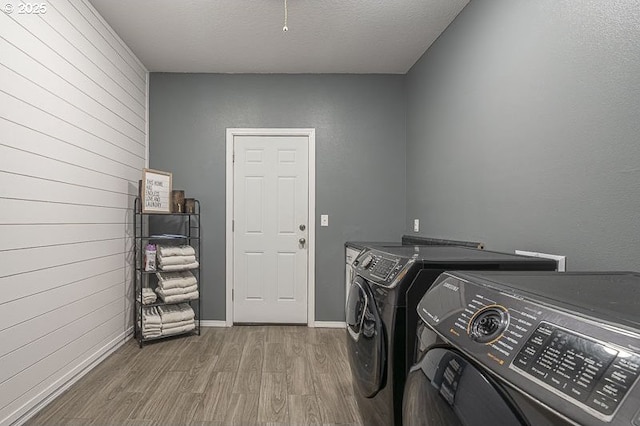 11364 James Way Dr SE, Aumsville, OR 97325 - laundry area featuring washer and clothes dryer, wood finished floors, wood walls, and baseboards