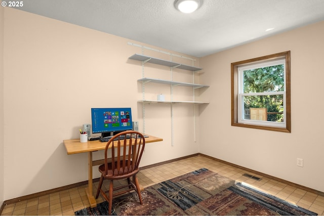 21456 SW 90th Ct, Tualatin, OR 97062 - office space with baseboards, a textured ceiling, and light tile patterned flooring