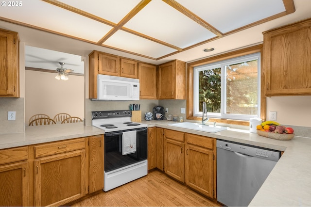 21456 SW 90th Ct, Tualatin, OR 97062 - kitchen featuring electric range, stainless steel dishwasher, white microwave, a sink, and light countertops