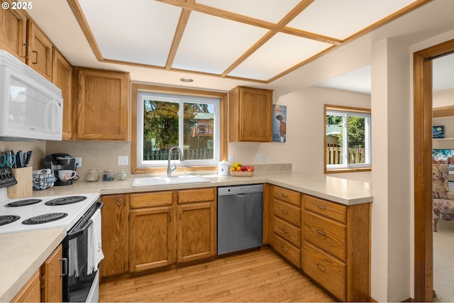 21456 SW 90th Ct, Tualatin, OR 97062 - kitchen with white microwave, dishwasher, electric range oven, a sink, and light countertops