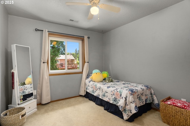 21456 SW 90th Ct, Tualatin, OR 97062 - bedroom featuring carpet flooring, baseboards, a ceiling fan, and a textured ceiling