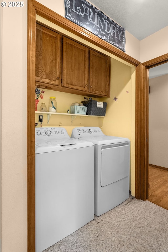 21456 SW 90th Ct, Tualatin, OR 97062 - laundry room featuring washing machine and dryer, cabinet space, and light colored carpet