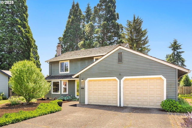 21456 SW 90th Ct, Tualatin, OR 97062 - traditional-style house featuring a chimney and a garage