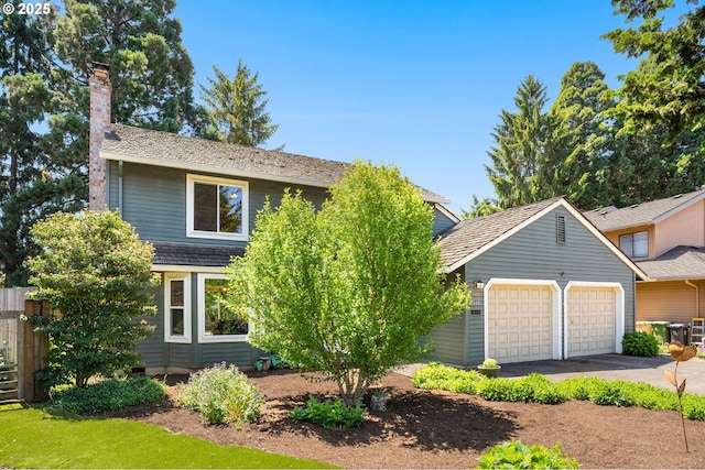 21456 SW 90th Ct, Tualatin, OR 97062 - view of front of property featuring a chimney and a garage