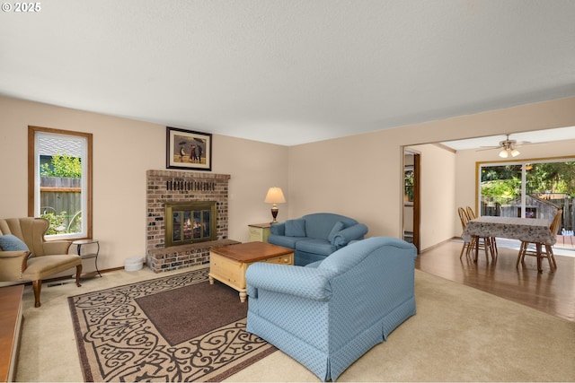 21456 SW 90th Ct, Tualatin, OR 97062 - living room with a brick fireplace, wood finished floors, and baseboards