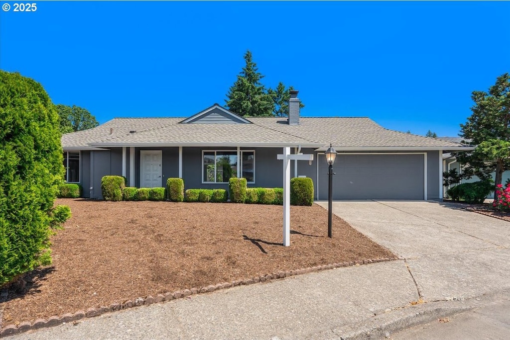 15920 SW Century Oak Cir, Portland, OR 97224 - ranch-style home featuring an attached garage, driveway, a chimney, and roof with shingles
