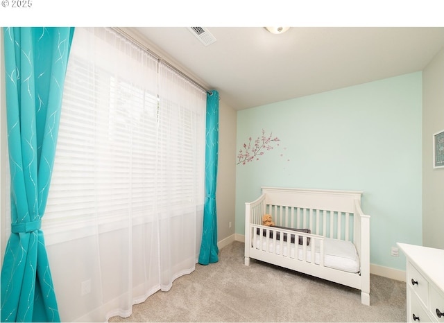 bedroom with light carpet, baseboards, and visible vents