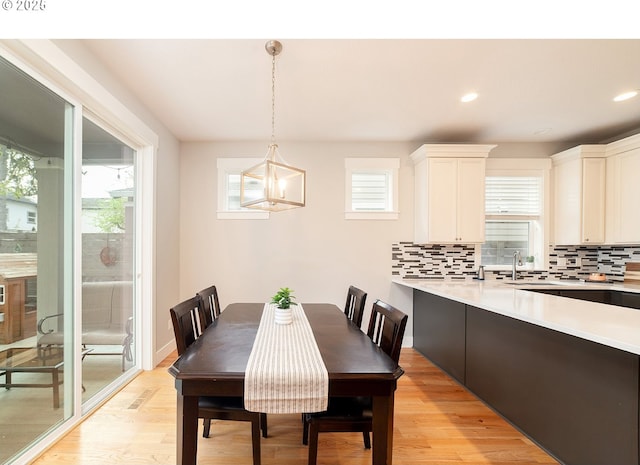 dining area with recessed lighting and light wood-style floors