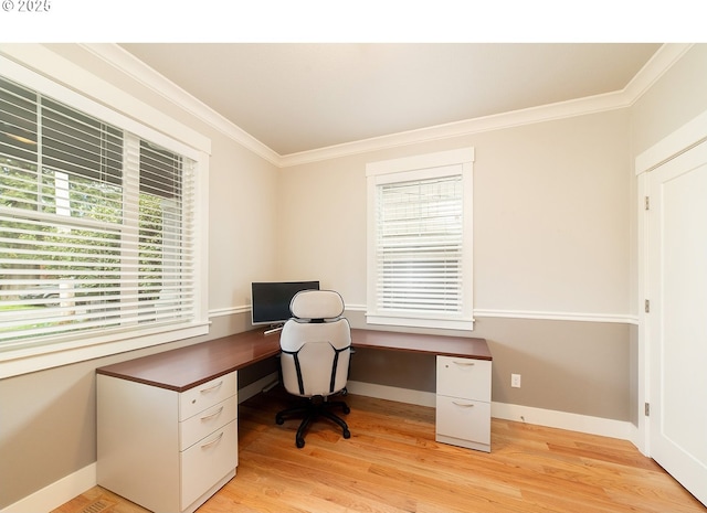 home office with light wood-style flooring, crown molding, and baseboards