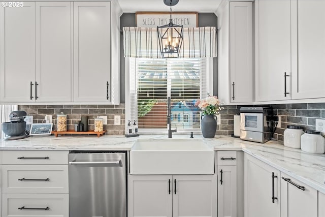 kitchen featuring sink, dishwasher, hanging light fixtures, backsplash, and white cabinets