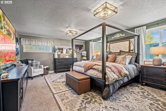 bedroom with carpet floors and a textured ceiling