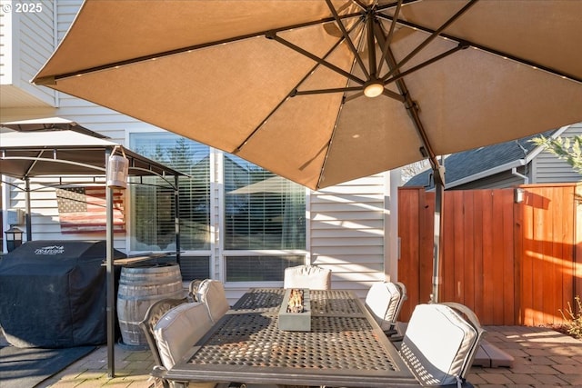 view of patio featuring area for grilling and a gazebo