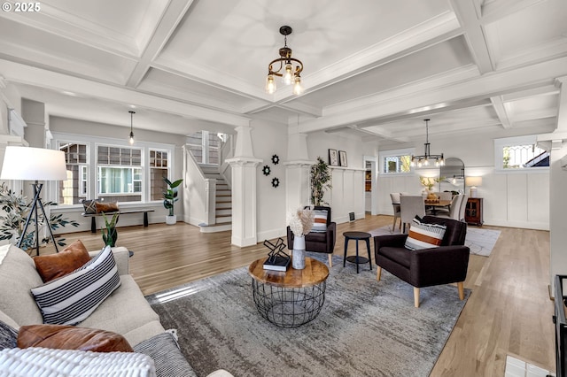3136 NE 41st Ave, Portland, OR 97212 - living room with coffered ceiling, wood finished floors, stairs, beamed ceiling, and a chandelier