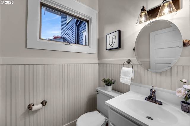 3136 NE 41st Ave, Portland, OR 97212 - half bathroom with a wainscoted wall, toilet, and vanity