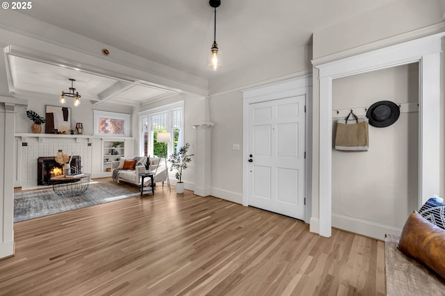 3136 NE 41st Ave, Portland, OR 97212 - foyer featuring light wood-type flooring, baseboards, and a fireplace