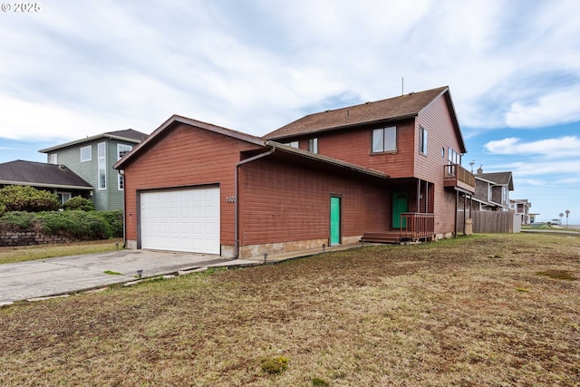 view of property exterior featuring concrete driveway, a lawn, and an attached garage